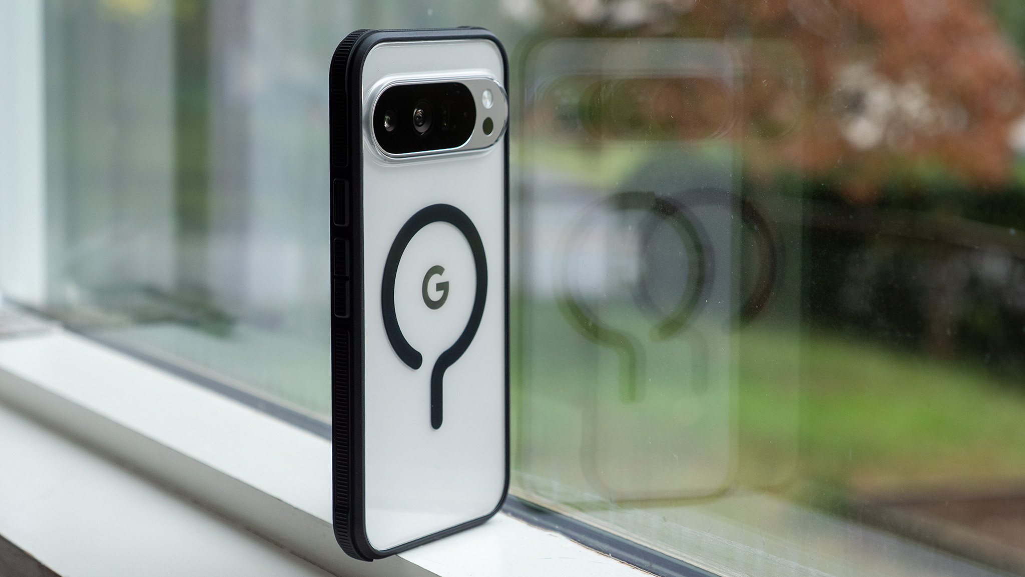 A Dbrand Ghost case on a porcelain Google Pixel 10 Pro XL