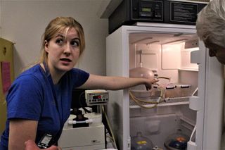 A Red Planet refrigerator is tended by Abigail Harrison, an astrobiologist who studies the growth of bacteria under Martian conditions.