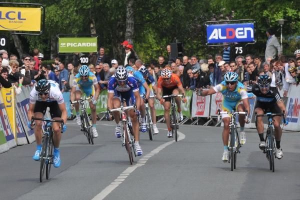 Allan Davis (Astana) appears upset, but there's little he can do to stop Ben Swift (left, Team Sky)