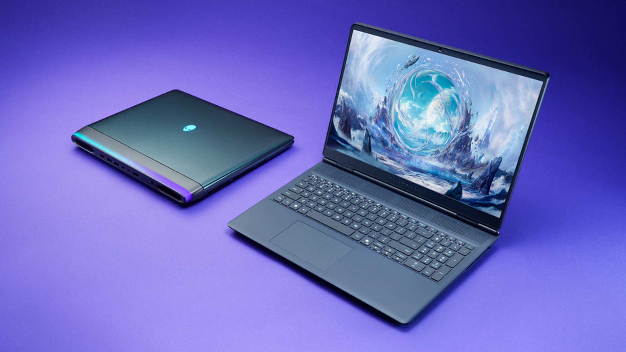 Two Alienware Area-51 laptops, one closed, one open. 