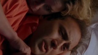 Elizabeth Shue holding Nicolas Cage in Leaving Las Vegas