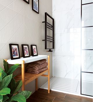 walk-in shower with marble tiled walls
