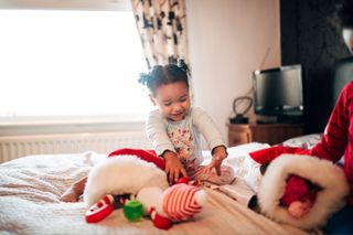 An image of Christmas stockings being opened