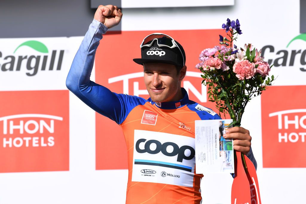 KILPISJARVI FINLAND AUGUST 06 Frederik Dversnes of Norway and Team Team COOP Salmon Mountain Jersey celebrates at podium during the 8th Arctic Race Of Norway 2021 Stage 2 a 178km stage from Nordkjosbotn to Storfjord Kilpisjrvi Finland ArcticRace on August 06 2021 in Kilpisjarvi Finland Photo by Stuart FranklinGetty Images
