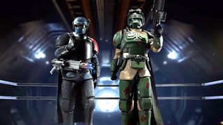 Two armored soldiers in futuristic gear stand in a dark, metallic corridor; one wears blue and black armor, the other wears green and tan camouflage.
