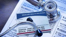 A stethescope and Medicare paperwork and card