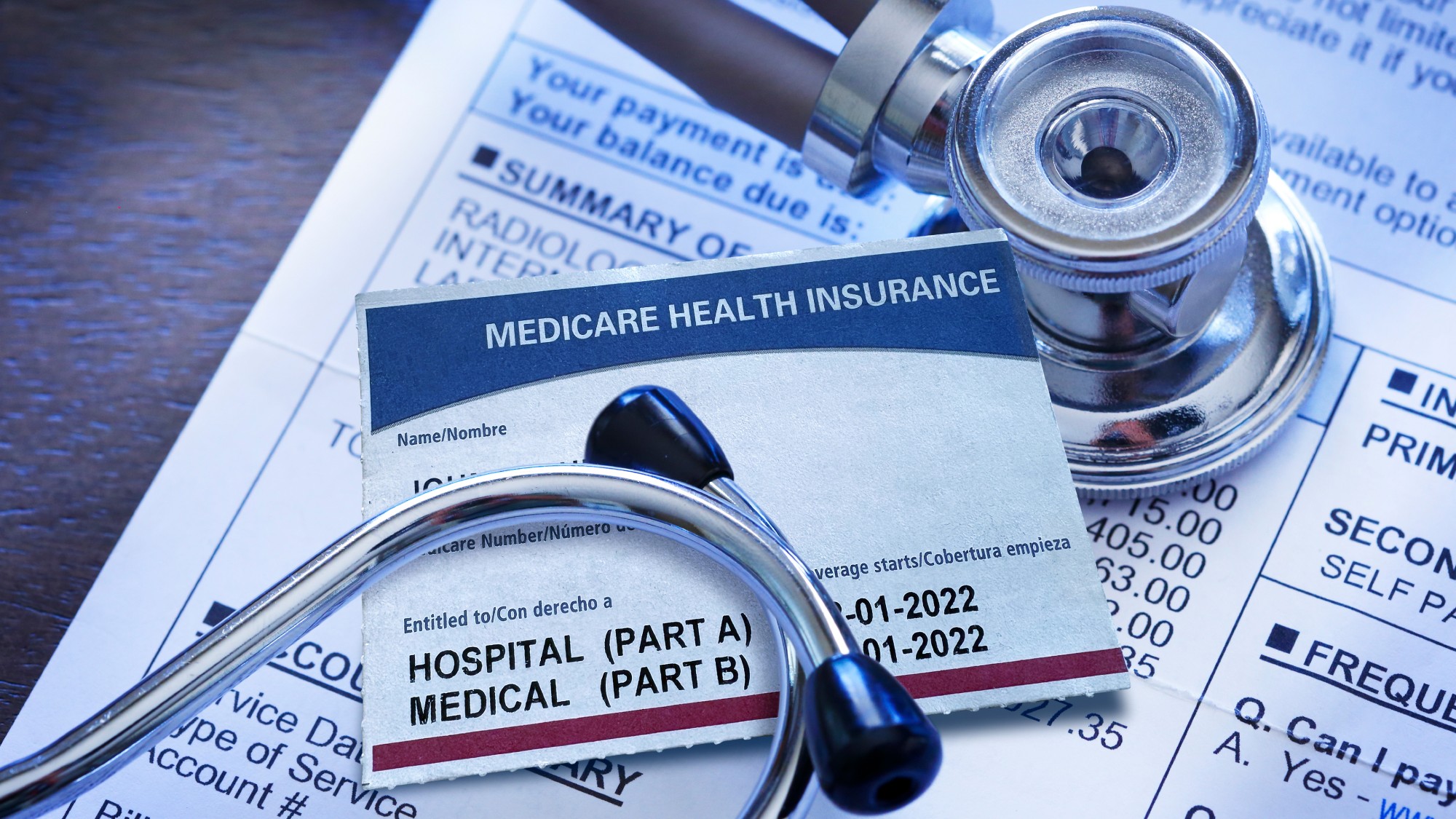 A stethescope and Medicare paperwork and card