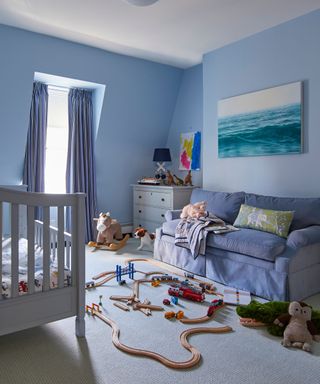 Blue child's room, blue sofa and curtains