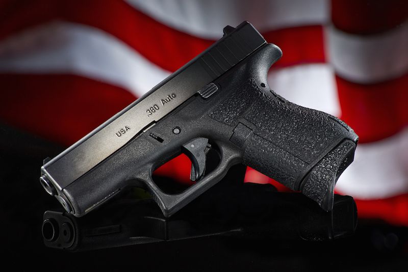 handgun with American flag background