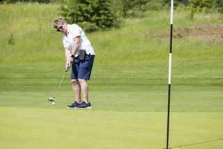 Sue Clowes putting in her Skechers Go Golf shoes