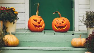 Pumpkins on green porch step