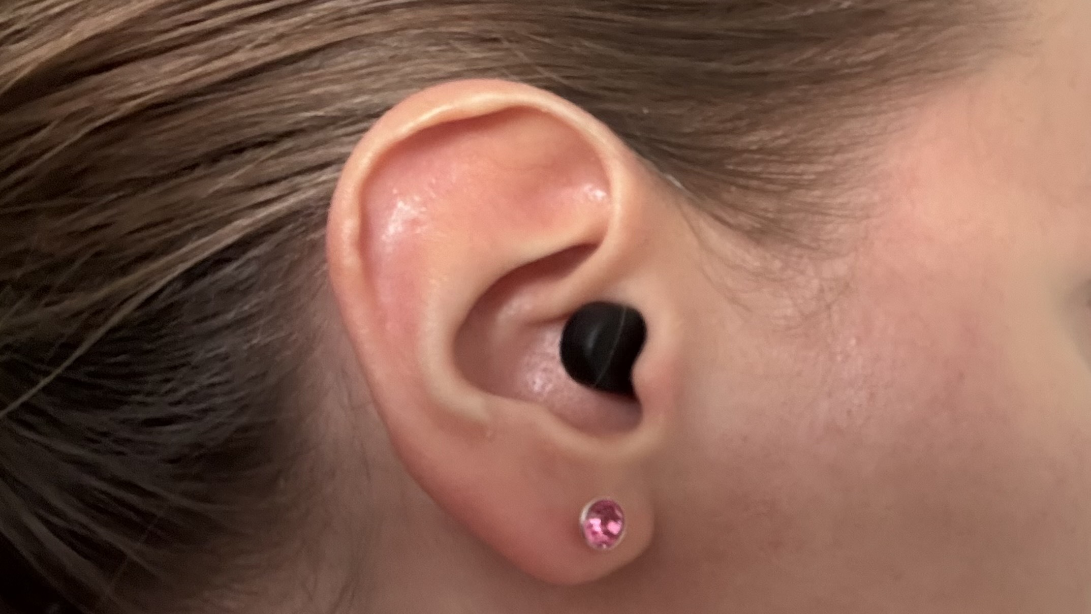The QuietOn 4 Sleep Earbuds in our tester's ear. 