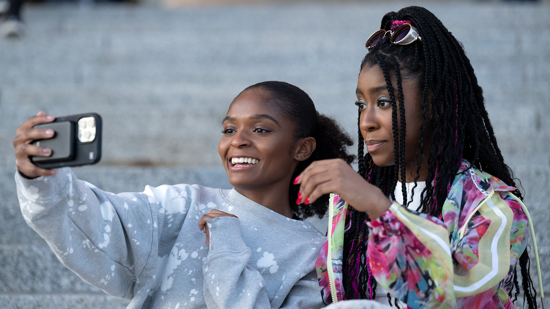 Riri Williams taking a photograph of her and Natalie using Riri's phone in Ironheart