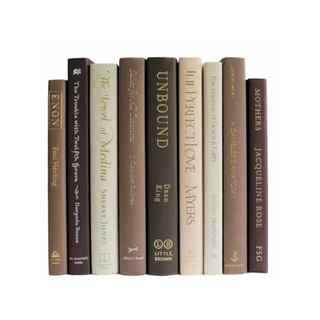 brown and cream-colored decorative staging books
