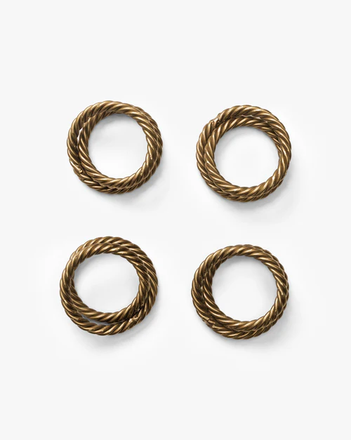 Twisted rope motif napkin rings in brass
