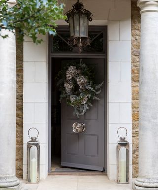 Outdoor Christmas decor with huge wreath on door