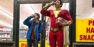 Shazam Freddy and Shazam chug a soda in front of the convenience store