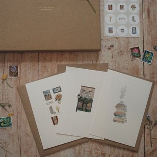 An illustrated stationary set on a wooden table