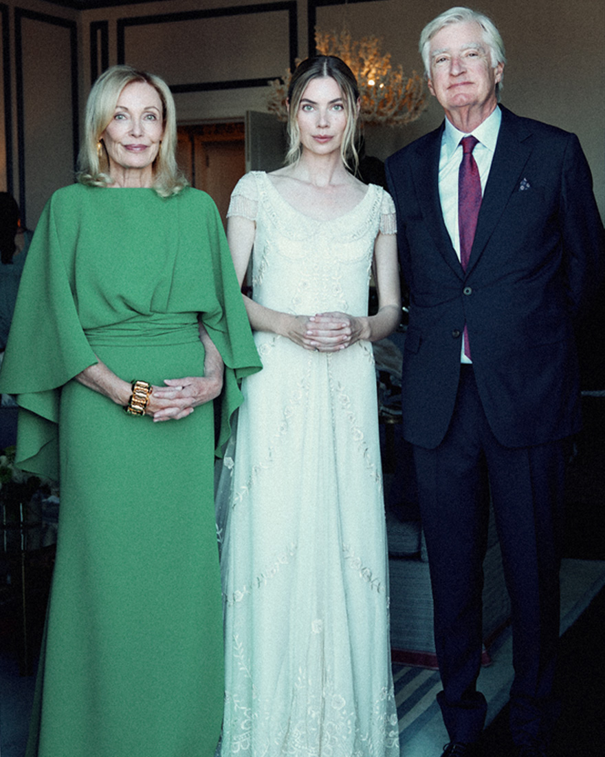 an image of georgie with her parents.