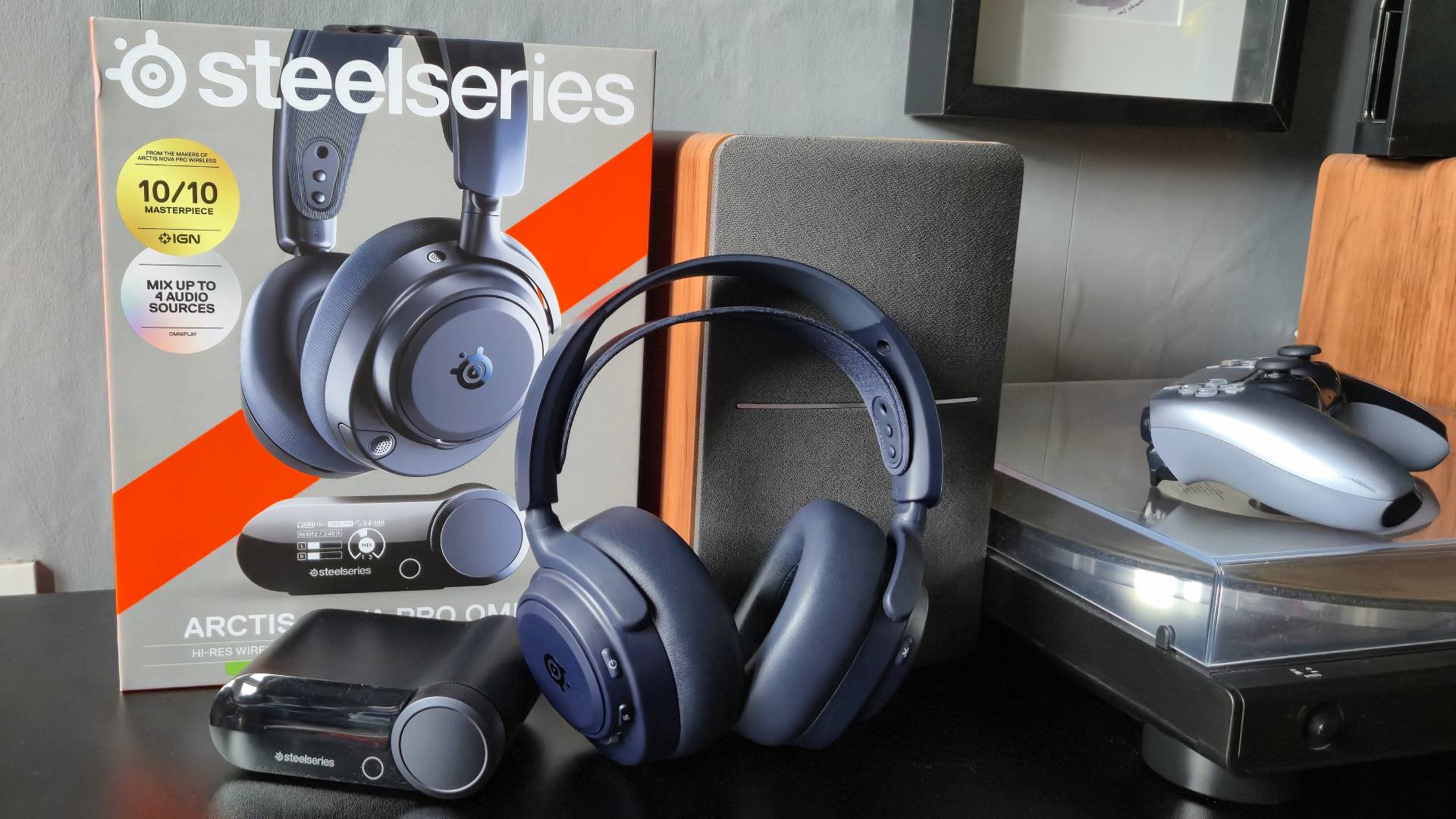 Image of the SteelSeries Arctis Nova Pro Omni headset sitting in front of a turntable.