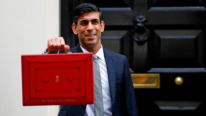 Chancellor of the Exchequer Rishi Sunak poses with the Budget Box outside 11 Downing Street 