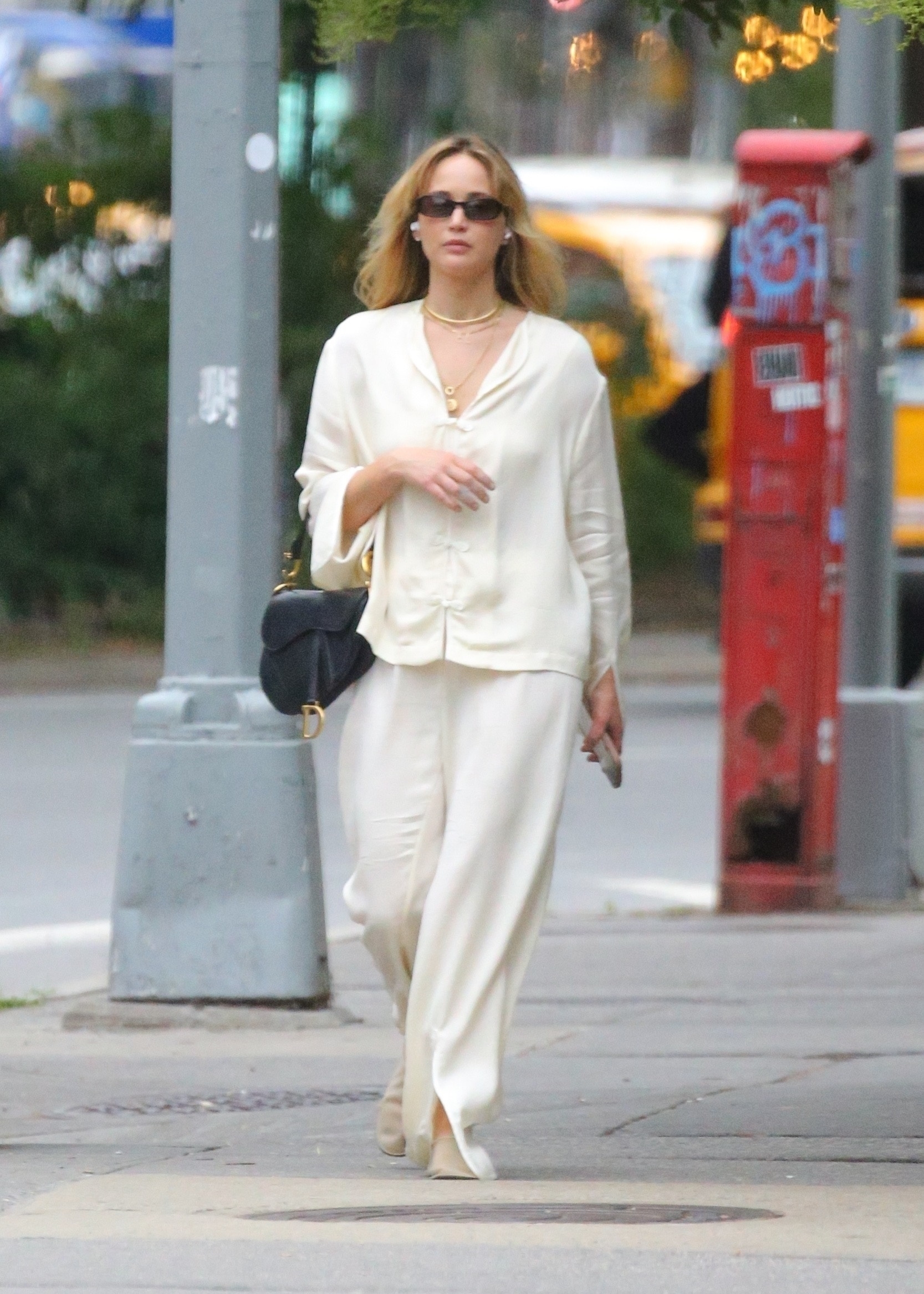 Jennifer Lawrence wore an all-white outfit with a Dior Saddle Bag in NYC