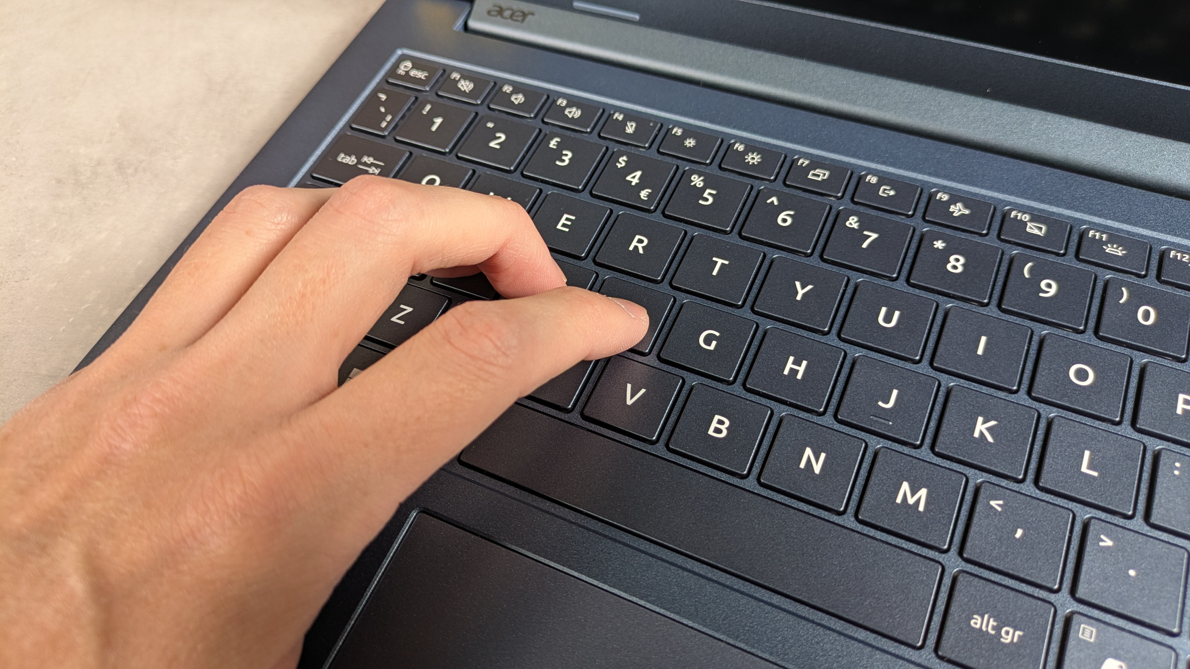 Hand typing on Acer Aspire 14 AI (2025)