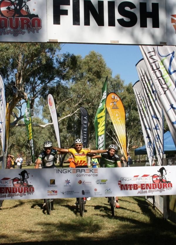 The lead trio crosses the finish togeterh