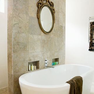 bathroom with white wall and mirror on wall
