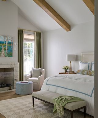 calming bedroom with neutral color scheme, accents of blue and green