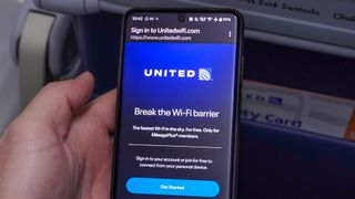 signing into Starlink on a phone during a United Airlines flight