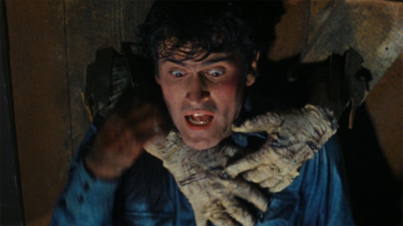 Ash being grabbed in The Evil Dead