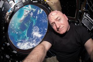 Scott Kelly, shown here in the cupola of the International Space Station, completed a yearlong space mission in March 2016.