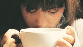 Woman drinking a cup of coffee