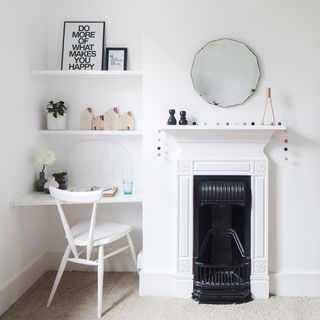 Corner desk with white wall and fire place