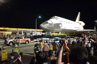 Space shuttle Endeavour is seen being towed by a 2012 Toyota Tundra truck in Los Angeles, Oct. 12, 2012.