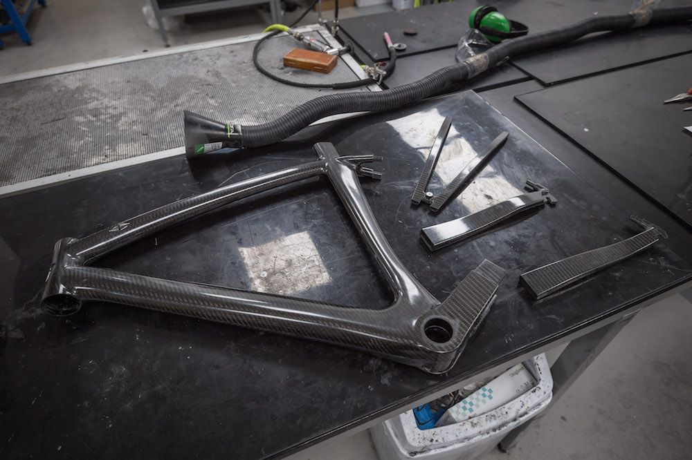 Carbon fiber bike frame laying on a table part assembled