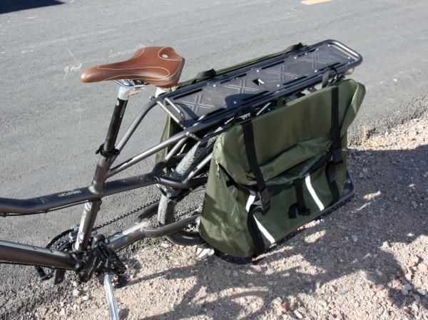 The rear panniers are designed to haul two full-size paper grocery bags each.