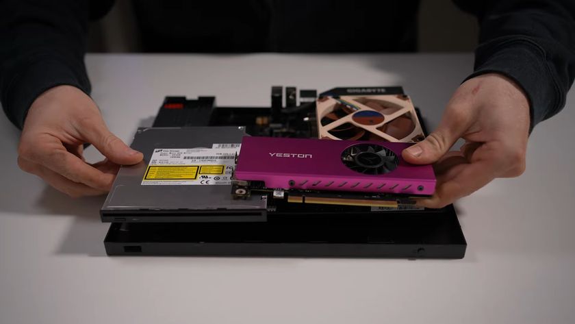 A modded Xbox One S with PC parts laid on the inside