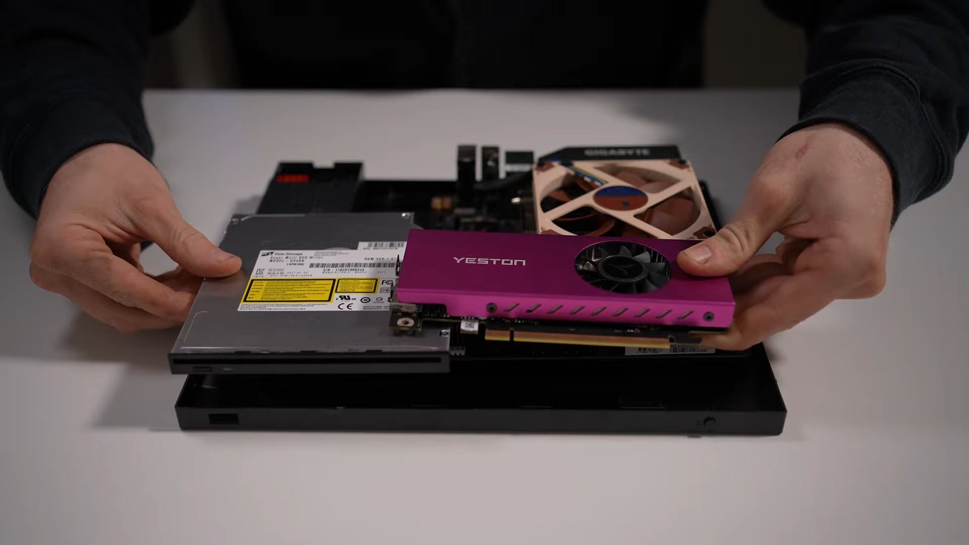 A modded Xbox One S with PC parts laid on the inside