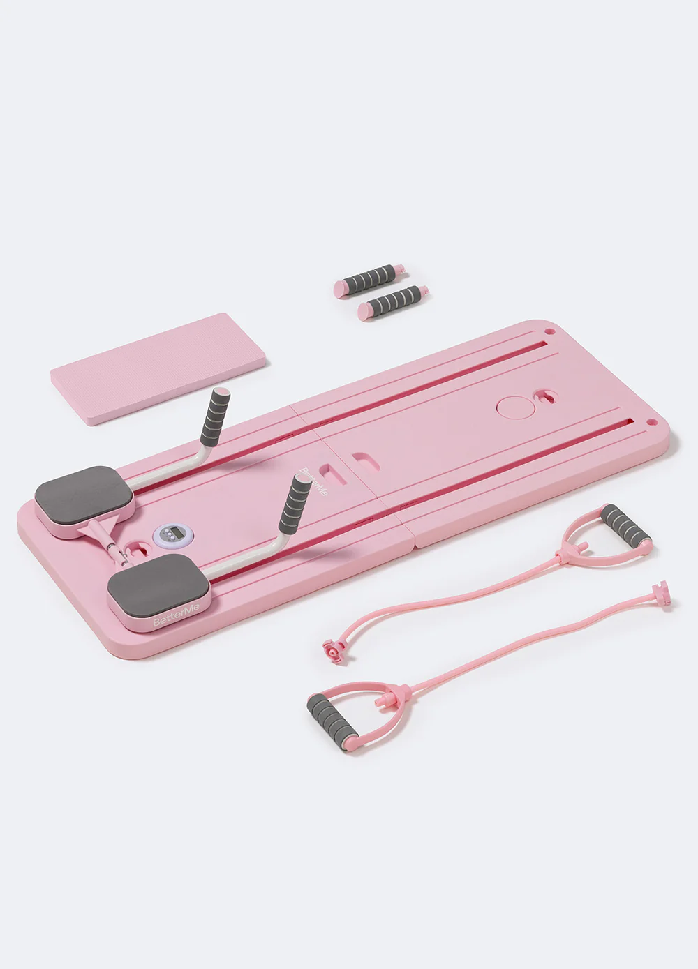 Pink board with sliding knee pads and handles on white floor with accessories next to it