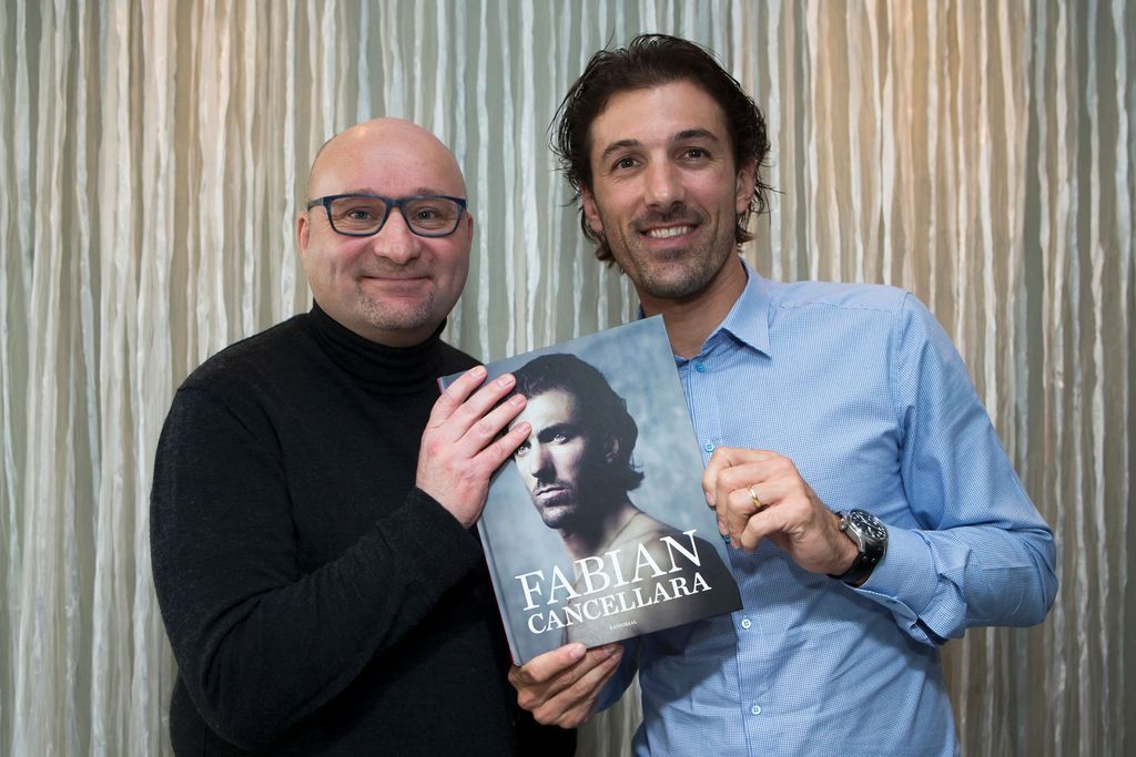 Fabian Cancellara (R) and journalist Guy Van Den Langenbergh pose during the presentation of the official farewell book 'Spartacus' in Antwerp