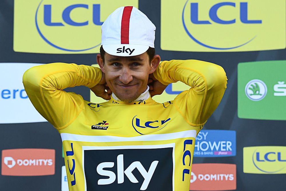 Michal Kwiatkowski pulls on the yellow jersey after stage 4 at Paris-Nice