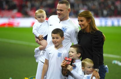Wayne Rooney and wife Coleen with their sons