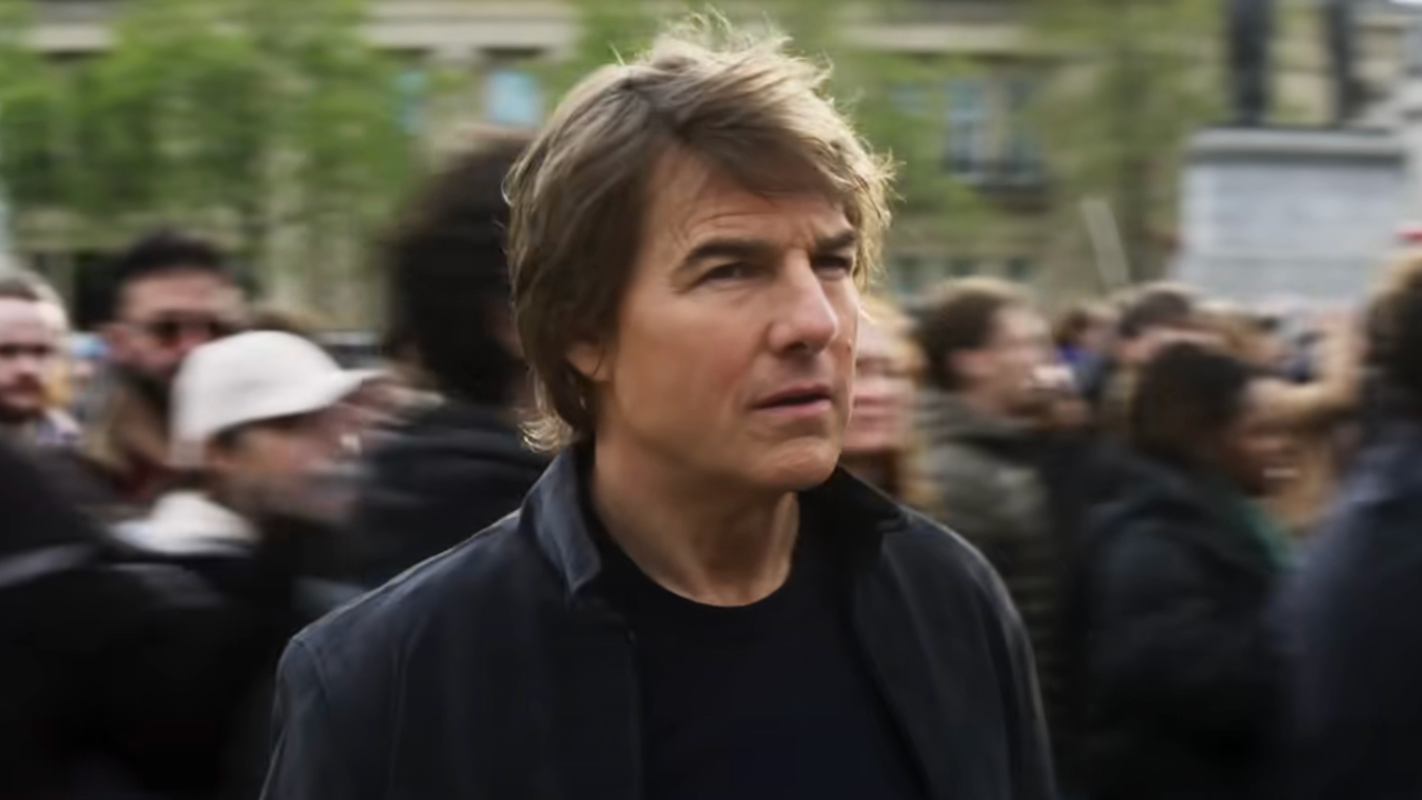 Mission: Impossible - The Final Reckoning - Tom Cruise stands amid a crowd of protesters.