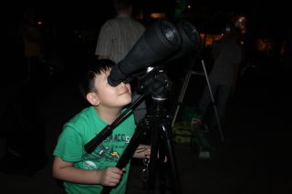 Larger binoculars gather more light from dim objects, but are heavy to hold, especially for youngsters. Simple mounting brackets available from most photo and sporting goods stores allow you to mount the binoculars on a camera tripod.