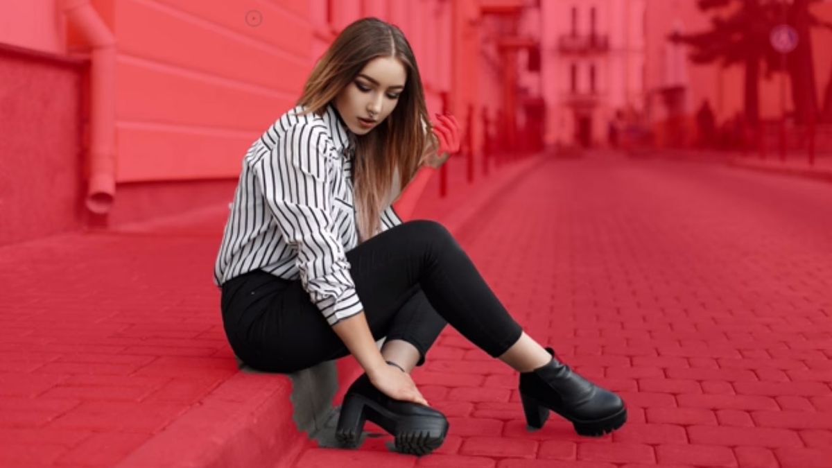 Woman selected against red background