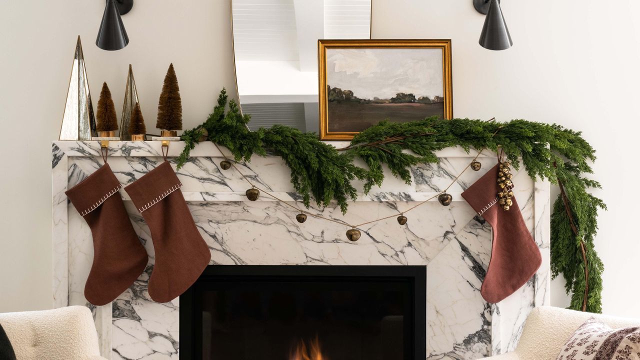 Christmas stockings over fireplace designed by Shea McGee