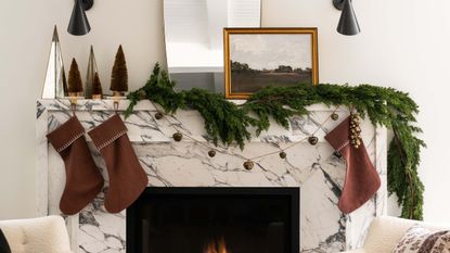 Christmas stockings over fireplace designed by Shea McGee