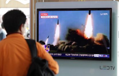 A person watched a North Korean rocket launch in 2014.